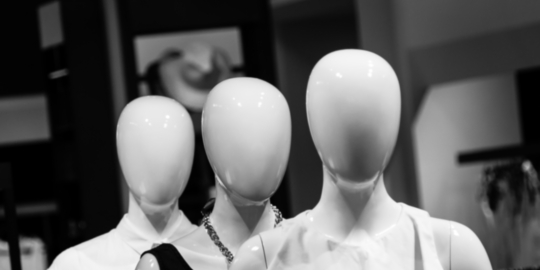 Image of some faceless mannequins